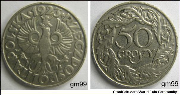 Obverse: Crowned eagle with wings spread facing, head left,
POLSKA RZECZPOSPOLITA LUDOWA date 1923
Reverse: Value over wreath,
50 GROSZY, (Aluminum)