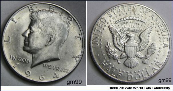 One Dollar 1964D (DENVER MINT)on reverse side.
President John F. Kennedy
The coin had the Heraldic Eagle, based on the Great Seal of the United States on the reverse.Mintage:
Circulation strikes: 156,205,446
Proofs: 0. Metal content:
Silver - 90%
Copper - 10%