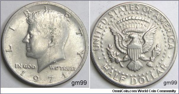 Half Dollar 
Mintmark: None (for Philadelphia, PA) centered above the date
Obverse design: President John F. Kennedy 
Reverse design: The Coat of Arms of the President of the United States