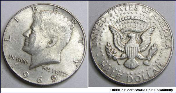Half Dollar
Weight: 12.5 g 
Composition: 60% silver, 40% copper 
Silver content: 11.25 g (0.3617 troy oz) 
Obverse design: President John F. Kennedy 
Reverse design: The Coat of Arms of the President of the United States