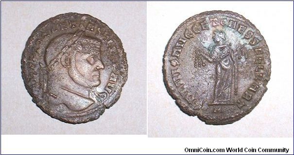 DIOCLETIAN AE Follis. 299-303 AD. IMP DIOCLETIANVS PF AVG, laureate head right / SALVIS AVGG ET CAESS FEL KART, Carthage standing left, holding fruits in both hands, A in ex. Mm 27,9 grs 7,7