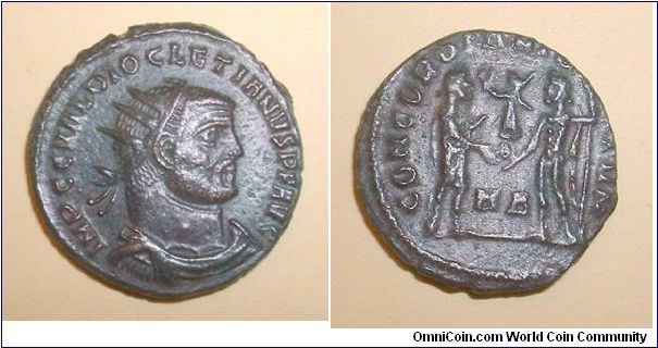 DIOCLETIAN - Post Reform Radiate. 2927296 - IMP C C VAL DIOCLETIANVS P F AVG, radiate draped bust right / CONCORDIA MILITVM, Diocletian standing right in military dress, receiving Victory on globe from Jupiter leaning on scepter, H A between.