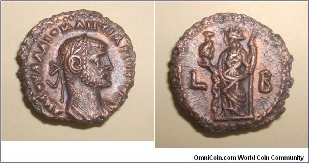 DIOCLETIAN - Alexandrian coins - Potin Tetradrachm of Alexandria. Year 2 = 285/286 AD. A K GOYA L DIOKLHTIANOC CEB, laureate draped bust right / L-B, Alexandria standing left holding head of Serapis & long scepter. Mm 19,8 grs 6,7