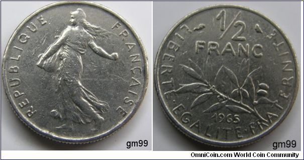 1/2 Franc
Obverse- Liberty walking left, sun with rays on right in background REPUBLIQUE FRANCAISE Reverse- Stalk below value LIBERTE EGALITE FRATERNITE 1/2 FRANC