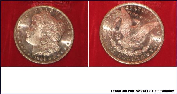 1884-O Morgan, given to me by my grandpa. Oil leaked from the slip it was in, otherwise in mint condition.