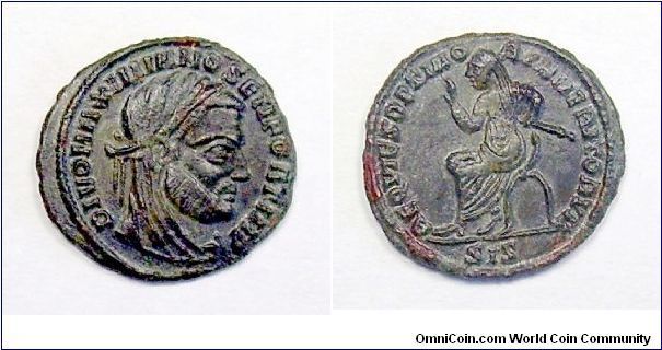 MAXIMIANUS AE3. 317-318 AD, posthumous issue struck under Constantine I. DIVO MAXIMIANO SEN FORT IMP, laureate veiled bust right / REQVIES OPTIMORVM MERITORVM, Emperor seated left on curule chair, raising hand & holding scepter, SIS in ex. Mm 17,1 grs 1,7 (rare)