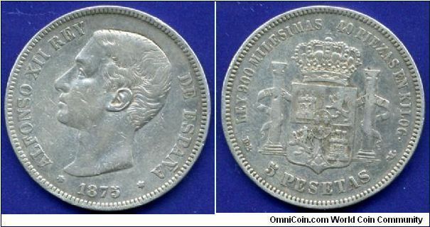 5 Pesetas.
King Alfonso XII (1874-1885).
'Small Nose' profil.
(M) Madrid mint.


Ag900f. 25gr.