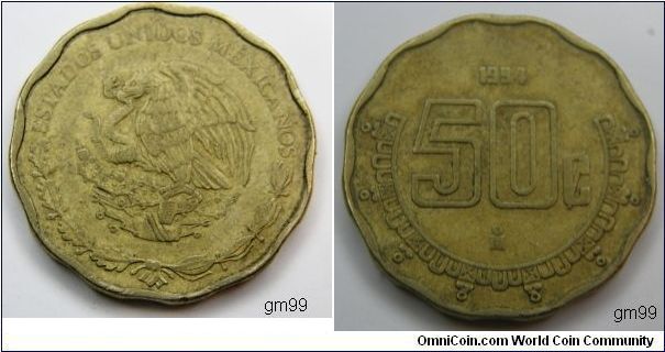 Brass, Obverse; National arms, eagle left. Reverse: Value and date.
50 centavos