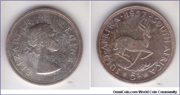 Proof 1957 5 shilling 
(crown), substantially toned but nice. Mintage 1,130 pieces.
