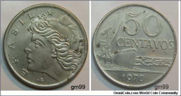 Obverse: Head of Liberty, left
BRASIL
Reverse: Ship at dock with bow to right, being loaded by crane,
 50 CENTAVOS date 1970,Stainless Steel
