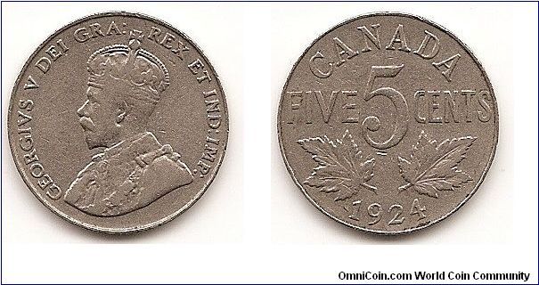 5 Cents
KM#29
4.5200 g. Comp.: Nickel Ruler: George V Obv.: King's bust
left Rev.: Maple leaves divide denomination and date Size: 21.2 mm.