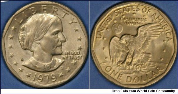Susan B Anthony dollar.   The new design for the US dollar coin also signaled a new size.  Trouble is, it is only a little larger than the quarter, so was not very popular.  Note the reverse design is the same as the Eisenhower it replaced.  Cu-Ni, 26.5 mm, S mintmark