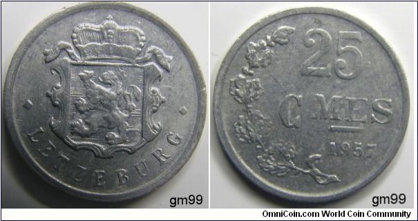 25 Centimes (Aluminum) Obverse; Crowned and ornamented shield with rampant lion left,
LETZEBURG
Reverse; Spring or half wreath to left of value
25 C MES, date 1957