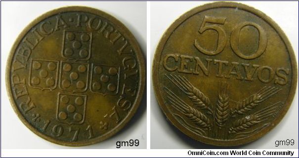 Bronze/Tones, 50 Centavos Obverse; Five shields arranged in the form of a cross, each having five dots on it 
REPVBLICA PORTVGVESA date 1971
Reverse; Value over five wheat stalks, one vertical, two diagonal on either side 
50 CENTAVOS