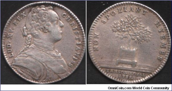 Silver jeton issued for the french treasury in 1735. This one bears an unusual portrait of Louis XV sporting pleated hair.