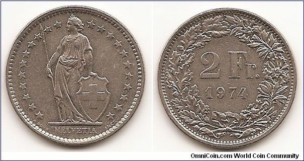 2 Francs
KM#21a.1
8.8000 g., Copper-Nickel, 27.4 mm. Obv: Standing Helvetia with
lance and shield within star border Rev: Value within wreath Edge:
Reeded