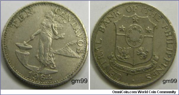 Obverse: Woman walking left, anvil to left, volcano in background to right,
TEN CENTAVOS 
Reverse: Shield,
CENTRAL BANK OF THE PHILIPPINES