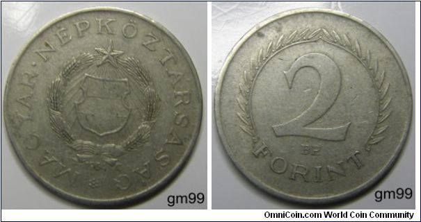 Obverse: Shield on globe with wreath around and star above,
MAGYAR NEPKOZTARSASAG date. Reverse: Value within wreath,2 Florint