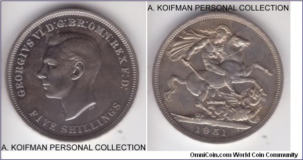 KM-880, 1951 Great Britain crown; copper-nickel, incuse lettered edge;  Festival of Britain commemorative in proof-like condition in original original maroon box; but what's unusual about it is the strike through mint error near by the King's ear.