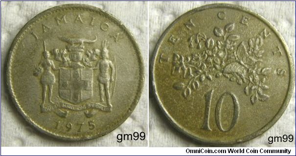 10 CENTS. Coat of Arms, crocodile on crested shield, man with bow on right, bare-breasted woman with shield on left, both in grass skirts, legend on banner below,
JAMAICA OUT OF MANY ONE PEOPLE date 1975