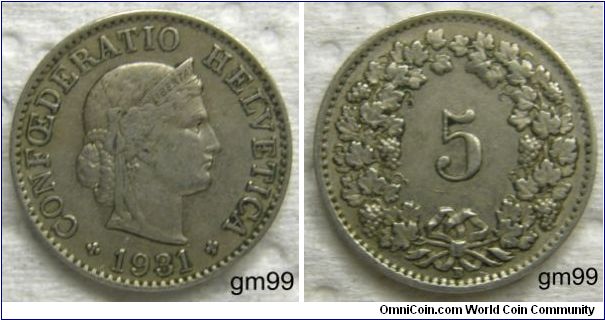 5 Rappen (Copper-Nickel) : 1879-1980
Obverse: Head of Helvetia right, LIBERTAS on headband,
CONFOEDERATIO HELVETICA date
Reverse: Value within wreath,
5