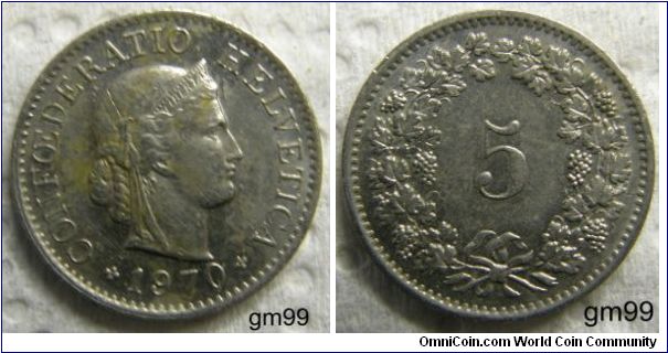 5 Rappen (Copper-Nickel) : 1879-1980
OBVERSE: Head of Helvetia right, LIBERTAS on headband,
CONFOEDERATIO HELVETICA date
REVERSE: Value within wreath,
 5