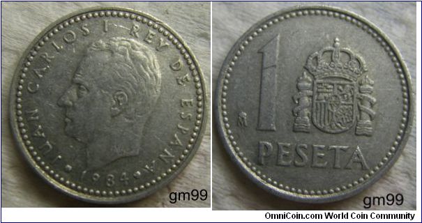 1 Peseta (
Obverse: Bare head of Juan Carlos left,
JUAN CARLOS I REY DE ESPANA date
Reverse: Crowned arms of Spain with Pillers of Hercules either side to the right of 1,
 1 PESETA