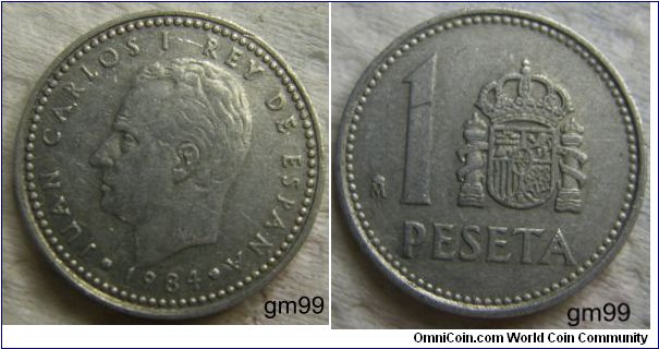1 Peseta (
Obverse: Bare head of Juan Carlos left,
JUAN CARLOS I REY DE ESPANA date
Reverse: Crowned arms of Spain with Pillers of Hercules either side to the right of 1,
 1 PESETA