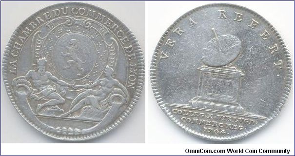 Silver jeton issued for Lyon Chambre de Commerce 1704. reverse depicts a sun dial (or an early example of a UFO tracking station if you stretch your imagination a bit).