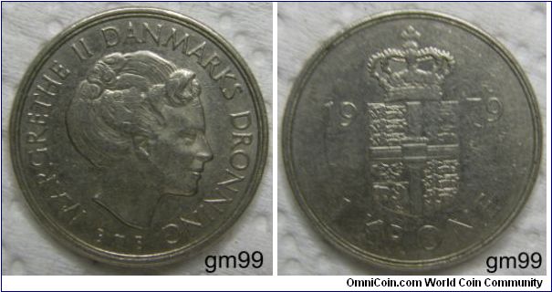 1 Krone. Obverse: Head of Margrethe II right,
MARGRETHE II DANMARKS DROWNING S heart B
Reverse: Crowned arms, shield with cross on it, R date KRONE