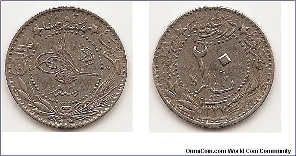 20 Para
KM#761
Nickel Obv: Toughra; “Reshat” to right Rev:Value within beaded circle above sprigs Mint: Qustantiniyah