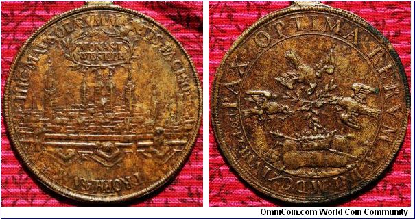 Medal Struck for the Peace of Westphalia 1648
REVERSE:  PAX OPTIMA  RERVM  Ao Dni MDCXLVIII 24 oct.  3 Doves with olive branches above a crown and scepter.
Obverse: HIC MAVSOLAEVM MARTIS PACISQ TROPHAEVM MONAST WESTPH.  View of fortified city K (perhaps for Ketteler who designed many of the great medalic pieces struck in this era)  Bronze 40mm.