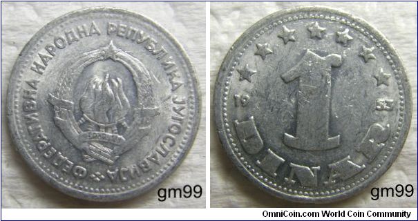 1 Dinar (Aluminum) : 1953
Obverse: Six torches in center as one, wheat stalks around and star above, 29.XI.1943 on banner. 
Reverse: 1 below semi-circle of seven stars,
 1 DINAR 1953