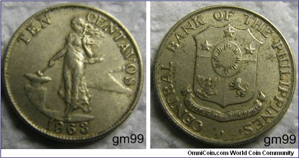 TEN CENTAVOS
Obverse: Woman walking left, anvil to left, volcano in background to right,
TEN CENTAVOS 
Reverse: Shield,
CENTRAL BANK OF THE PHILIPPINES