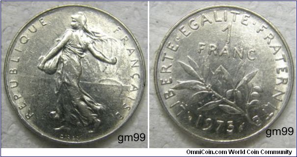 Nickel 1 Franc (1975)
Obverse;  Liberty walking left, sun with rays on right in background 
REPUBLIQUE FRANCAISE 
Reverse;  Stalk below value 
LIBERTE EGALITE FRATERNITE 1 FRANC 1975