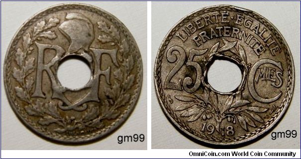 25 Centimes (Copper-Nickel) : 1917-1937
Obverse: Letters within wreath, either side of hole,
 R F
Reverse: Wreath below and between value,
 LIBERTE EGALITE FRATERNITE 25 CMES date
