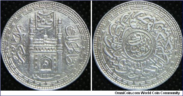 India-Princely States - Hyderabad State. Mir Mahbub Ali Khan II (AH1285 - 1329/1896-1911 AD). Nizamate, One Rupee, AH1323 (1905). 11.1780 g, 0.8180 Silver, .2940 Oz. ASW., 30mm. Mintage: Unknown. Good XF.