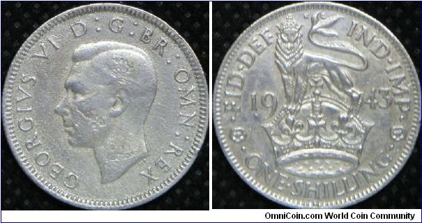 King George VI, British One Shilling, 1943. Reverse: Lion atop crown dividing date. 5.6552 g, 0.5000 Silver, .0909 Oz. ASW. Mintage: 11,404,000 units. Good F.