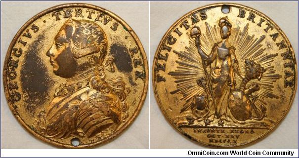 Medal for the accession of George III October 25th 1760. 40mm gilt bronze by Pingo.REV:
FELICITAS BRITANNIAE.      INEUNTE REGNO.  Notice Britannia and the Lion treading on the fleur-de-lis.
