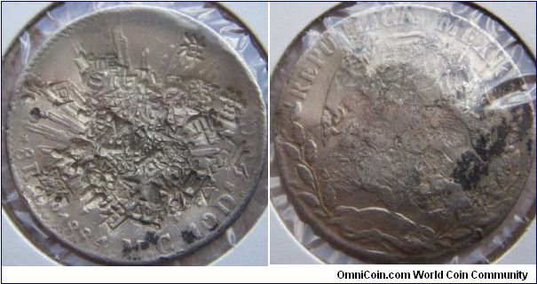 8 Reales, 1884/3 Overdate. Heavily chopmarked, type 2.