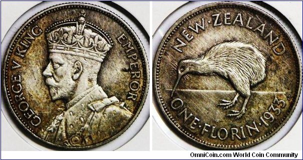 George V, New Zealand One Florin, 1933. 11.3100 g, 0.5000 Silver, .1818 Oz. ASW. 28.58mm. Reverse: Kiwi bird. Mintage: 2,100,000 units. Nicely toned, UNC.