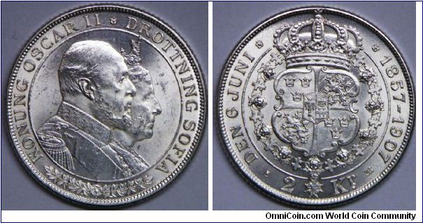 Oscar II (1872 - 1916), 2 Kronor, 1907. Subject: Golden Wedding Anniversary. Obv: Busts of King Oscar II & Queen Sofia. Rev: Crowned arms within order chain. 15.0000 g, 0.8000 Silver, .3858 Oz. ASW., 31mm. Mintage: 251,000 units. AU.