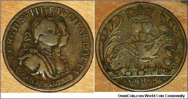 Coronation Medal 1761. Obverse: Bare-headed busts of George III and Charlotte right. Reverse: View of London.  On scroll: FELICITAS BRITANNIAE; in exergue: DIIS AUSPICIBUS MDCCLXI. 25mm Bronze.