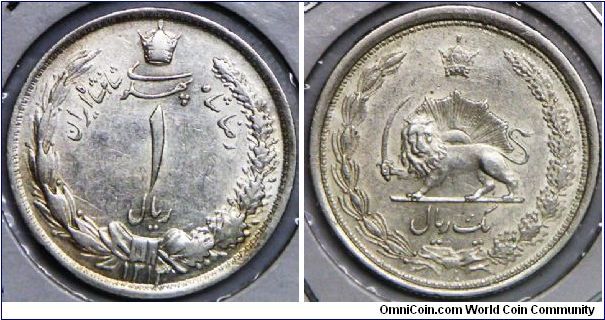 Reza Shah (AH 1344 - 1360/ 1925 - 1941 AD), 1 Rial, AH1313 (1934). 5.0000 g, 0.8280 Silver, .1331 Oz. ASW., 22.5mm. Mintage: 6,670,000 units. VF to VF+. [SOLD]