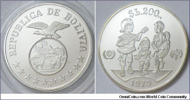 Republic, 200 Pesos Bolivianos, 1979. 23.3330 g, 0.9250 Silver, .6938 Oz. ASW. Subject: International Year of the Child. Obv: State emblem within circle eagle at top, stars below. Rev: Children divide small symbols, date at bottom, denomination at top. Note: Medal rotation. Mintage: 15,000 units. PROOF.