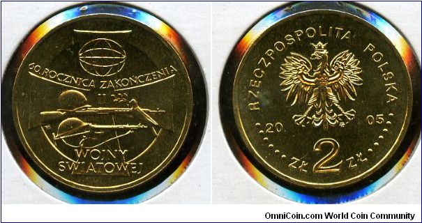2 zloty
60th anniversary of the ending of World War II
Combat helmet of WZ 40 type on a automatic rifle SWT-40, with British helmet (Mk II) placed on the Sten gun, Cross of the Valorous in the background and pigeon with
the olive branch in its beak on the barrel of a pistol.
Eagle, value & date
