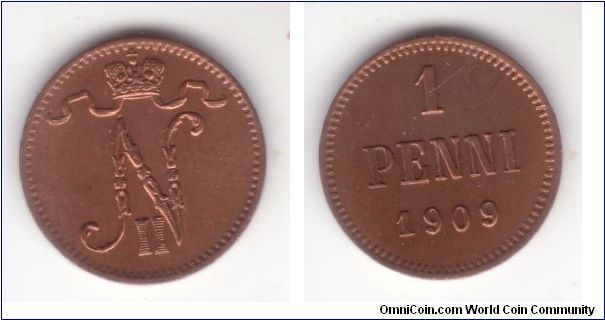 KM-13, 1909 Finland (Grand Duchy) penni; red obverse and red with brownish toning reverse; uncirculated but with a couple of scratches on the reverse as seen by the 1; also a die break on E in PENNI created a funny reverse leaf on the vertical line of E.