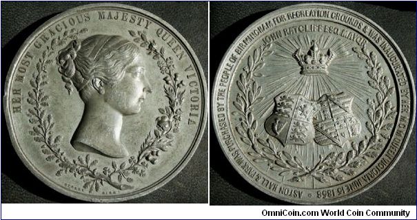 Medal struck to celebrate the opening of Aston Hall by Queen Victoria in 1858. 'HER MOST GRACIOUS MAJESTY QUEEN VICTORIA', and at the base is the name of 'Ottley Birm. Rev: John Ratcliff Esq, Mayor 'ASTON HALL & PARK WAS PURCHASED BY THE PEOPLE OF BIRMINGHAM FOR RECREATION GROUNDS & WAS INAUGURATED BY HER MGM QUEEN VICTORIA JUNE 15 1858'.  W.M. 73mm