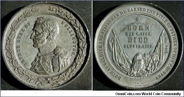 Wellington Death Medal.  Obv: AURTHUR DUKE OF WELLINGTON. Rev: BOTH AS SOLDIER ANS STATESMAN HE EARNED THE TITLE OF FATHER OF HIS COUNTRY.  BORN MAY I, 1769 DIED SEP 14 1852, On the flags ASSAYE & WATERLOO.  by Allen & Moore Birmingham. WM. 64 mm.