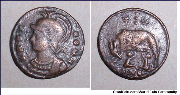 City Commemorative AE3. 330-335 AD. VRBS ROMA, helmeted bust of Roma left / she-wolf & twins, 2 stars above with vertical three dots between, SMNE in ex. Nicomedia mint. mm 17,8 grs 2,4